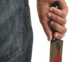 A file photo shows a bloody knife.