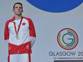 Gold-medallist Canada’s Ryan Cochrane poses on the podium during after winning the men’s 1,500m freestyle at the Commonwealth Games in Glasgow last month. Cochrane has benefited greatly from the Canadian Athletes Now Fun. (AFP)
