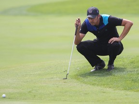 Brock MacKenzie lines up a putt on the 17th hole on Thursday during the first round of the PGA Tour Canada's Great Waterway Classic. (Julia McKay/The Whig-Standard)