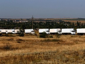 A Russian convoy of trucks carrying humanitarian aid for Ukraine drives in the direction of the Ukrainian border near Donetsk, Rostov Region, August 22, 2014. REUTERS/Alexander Demianchuk