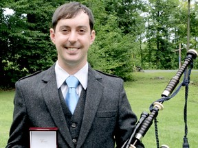Jacob Dicker is pictured with his Piobaireachd Society Gold Medal from the Glengarry Highland Games in Maxville, Ont. The Sarnia native won the prestigious award Aug. 1. (Submitted photo)