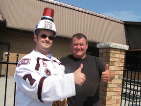 Maroons superfan Chad Peterson (left) is calling on the community to get behind the Kraft Hockeyville Internet promotion to win money for upgrades to Memorial Arena. Peterson is hosting a “hockey town” rally Aug. 29 at Encore to raise awareness for the promotion. Pictured with Peterson is Encore owner Tim Mielczarek.