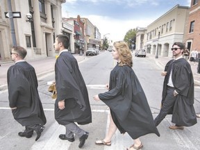 Laurier Brantford students cross Market St. in downtown Brantford in June while on their way to their convocation ceremony. (BRIAN THOMPSON, QMI Agency)