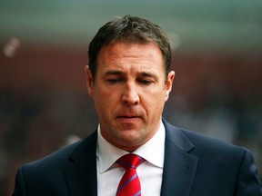 Malky Mackay apologized Friday after racist and homophobic texts by the former Cardiff manager were published in the Daily Mail. (Reuters)