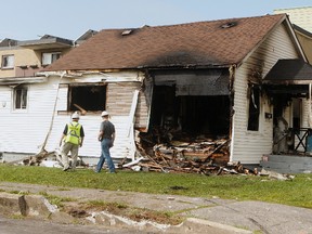 A car smashed through the wall of a house in Oshawa. (CHRIS DOUCETTE, Toronto Sun)