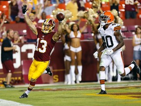 Redskins wide receiver Nick Williams (left) celebrates after scoring a touchdown ahead of Browns defensive back Royce Adams (right) during pre-season NFL action in Landover, Md., on Aug. 18, 2014. (Geoff Burke/USA TODAY Sports)