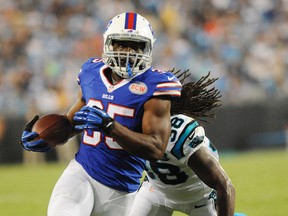 Bills running back Bryce Brown (35) runs the ball as he is pursued by Panthers safety Robert Lester (38) during pre-season NFL action in Charlotte, N.C. on Aug. 8, 2014. (Sam Sharpe/USA TODAY Sports)