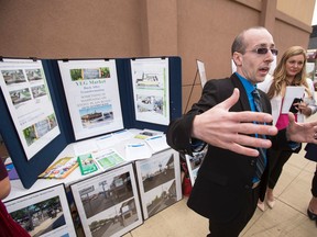 Coun. Andrew Knack (right) speaks to reporters during a City of Edmonton press conference at Stony Plain Road and 153 Street in Edmonton, Alta., on Friday, Aug. 22, 2014. City staff provided an update on the Stony Plain Road Streetscape Project. Ian Kucerak/Edmonton Sun/ QMI Agency