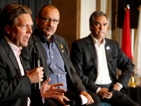 Candidates Thomas Lukazsuk, Ric McIver and Jim Prentice (L-R) speak during a provincial Tory leadership debate in Calgary, Alta., on Friday, Aug. 22, 2014. The party will choose its leader on Sept. 6 or, if a second ballot is required, Sept. 20. Lyle Aspinall/Calgary Sun/QMI Agency