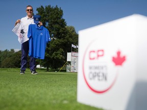 London Hunt and Country Club head pro Tim McKeiver shows off some of the Canadian Pacific Women's Open merchandise for sale at the LPGA event being held at the golf club in London, Ontario on Friday August 22, 2014. (CRAIG GLOVER, The London Free Press)