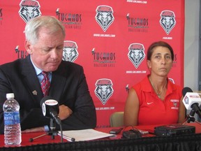 University of New Mexico VP of athletics Paul Krebs (left) and women's soccer head coach Kit Vela speak to reporters during a news conference in Albuquerque on Aug. 20, 2014. Vela was suspended for one week, but will not miss any games. (Joe Kolb)