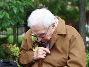 JOHN LAPPA/THE SUDBURY STAR
John Stefura takes part in a moment of silence during a plaque unveiling at Hnatyshyn Park in Sudbury, ON. on Friday, August 22, 2014.