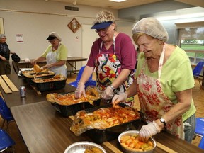 JOHN LAPPA/THE SUDBURY STAR
In this file photo, Sandra Hammond and Bernice Crowe, right, place cabbage rolls in containers at the Ukrainian Seniors' Centre for the annual Canadian Garlic Festival in Sudbury.