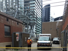 A transformer station on Wellington St., just west of John St.,remains cordoned off after a worker was electrocuted Saturday morning. (Chris Doucette/Toronto Sun)