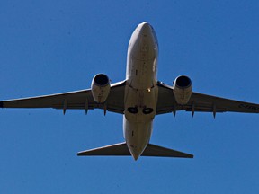 An airplane takes off from Edmonton International Airport in Leduc, Alta., on Friday, June 20, 2014. Codie McLachlan/Edmonton Sun/QMI Agency