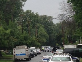 Police negotiators, tactical officers and paramedics respond to a home on Scrivens St., off Carling Ave. in the Bayshore/Britannia area in early August where a man was barricaded inside for more than two hours. 
(Reader photo by Nicholas Stewart)