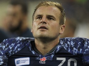 Winnipeg Blue Bombers K Lirim Hajrullahu watches a replay during CFL action against the Montreal Alouettes at Investors Group Field in Winnipeg, Man., on Fri., Aug. 22, 2014.