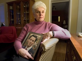Carolyn Swinson hold a picture of her son Robert, who was killed by a drunk driver in 1996. (Toronto Sun file photo)