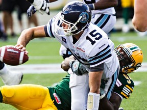 Edmonton's Cameron Sheffield (94) sacks Toronto's quarterback Ricky Ray (15) during the Edmonton Eskimos' CFL football game against the Toronto Argonauts at Commonwealth Stadium in Edmonton, Alta., on Saturday, Aug. 23, 2014. The Eskimos won by a score of 41-27. Codie McLachlan/Edmonton Sun/QMI Agency