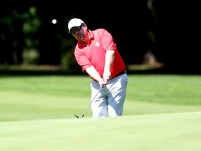 Wiliam McMurry chips a shot onto the green at Club de golf Outaouais during the Ottawa Sun Scramble's Championship Saturday, Aug. 23, 2014.
(Chris Hofley/Ottawa Sun)​​