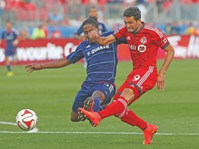 TFC’s Gilberto takes a shot against a Chicago defender on Saturday night at BMO Field. The Brazilian’s goal couldn’t hold up as the winner. (DAVE THOMAS/Toronto Sun)