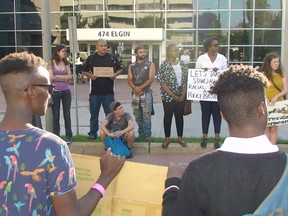 About 40 people gathered outside of Ottawa Police headquarters along Elgin  St. on Saturday for a protest against police brutality and racial profiling following events in Ferguson, U.S.
DANIELLE BELL/OTTAWA SUN/QMI AGENCY