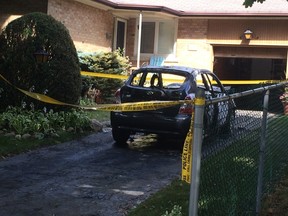 One of the vehicles set on fire in North York early Sunday. (MARYAM SHAH, Toronto Sun)