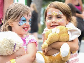 Friends Janaya Forbes, 4, and Jaiden Marquardt, 5, give their favourite toys a big hug during the Tiny Hoppers Teddy Bear Picnic at Lake Ontario Park on Saturday. (Julia McKay/The Whig-Standard)
