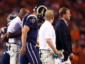 St. Louis Rams quarterback Sam Bradford (8) is helped off the field after getting injury in the first quarter against the Cleveland Browns at FirstEnergy Stadium. (Rick Osentoski-USA TODAY Sports)