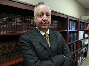 James Lowry, a retired police officer turned defence lawyer, is pictured in his office in downtown Winnipeg, Man., on Fri., Aug. 22, 2014. (Kevin King/Winnipeg Sun/QMI Agency)