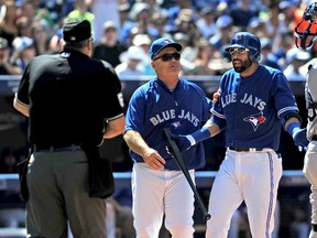 Toronto Blue Jays manager John Gibbons moves in between umpire Bill Welke and right fielder Jose Bautista after Bautista was tossed for arguing a strike three call in the sixth inning of the Jays 2-1 loss to the Tampa Bay Rays at Rogers Centre. (Dan Hamilton-USA TODAY Sports)