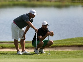 Former NHLer Marc Savard and playing partner Michael Farrugia line up a putt on Championship Sunday of the Ottawa Sun Scramble at Eagle Creek Golf Club.
(Chris Hofley/Ottawa Sun)