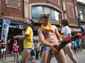 Revellers take part in the Ottawa Pride Parade on Bank Street, August, 24, 2014. Over 75,000 people were said to take part in the days festivities.    
(Chris Roussakis/Ottawa Sun)
