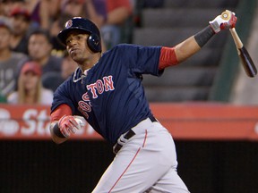 Boston Red Sox left fielder Yoenis Cespedes (52) follows through on a two-run double in the third inning against the Los Angeles Angels at Angel Stadium of Anaheim on Aug. 8, 2014. (KIRBY LEE/USA TODAY Sports)