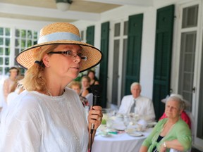 Angela Smylie speaks at an afternoon tea party, inspired by British television series Downton Abbey. Proceeds from the event held at Montrose Inn Sunday will be dedicated to the Roy Bonisteel Tribute Garden. 
JASON MILLER The Intelligencer