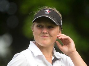 Brooke Henderson of Smiths Falls, Ontario smiles at fans as she walks off the fifth tee box during the final round of the 2014 Canadian Pacific Women's Canadian Open at the London Hunt and Country Club in London, Ontario on Sunday August 24, 2014.
CRAIG GLOVER/The London Free Press/QMI Agency