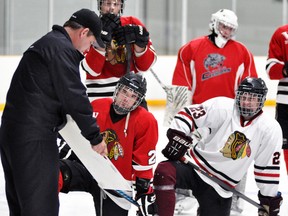 Under the guidance of new head coach Duane Harmer (left), the Mitchell Hawks of the Western Jr. C league opened their training camp with three different tryouts last week in Stratford. ANDY BADER/MITCHELL ADVOCATE