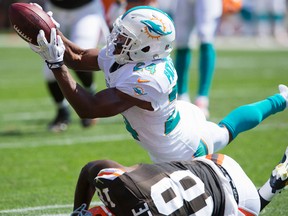 Cornerback Dimitri Patterson of the Miami Dolphins hauls in an interception intended for wide receiver Greg Little of the Cleveland Browns during the first half at First Energy Stadium on September 8, 2013. (Jason Miller/Getty Images/AFP)