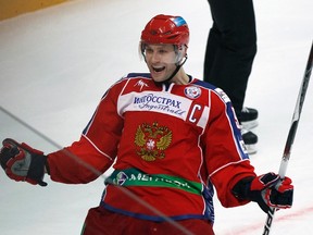Russia's Alexei Morozov celebrates a goal scored by teammate Nikolay Belov against Sweden during their Channel One Cup game in Moscow on December 16, 2010. (REUTERS/Grigory Dukor)
