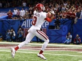 Jalen Saunders #8 of the Oklahoma Sooners catches a touchdown pass against the Alabama Crimson Tide. (Streeter Lecka/Getty Images/AFP)