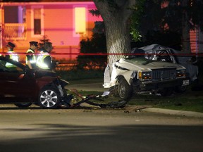 Police investigate at the scene of a fatal car accident along 151 Street north of 95 Avenue, in Edmonton Alta., on Sunday Aug. 24, 2014. Two people in the car were pronounced dead at the scene. Police believe speed and alcohol  were factors. David Bloom/Edmonton Sun