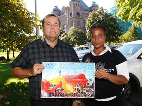 Jesus in the City Parade organizers Charles McVety and Ayanna Solomon with parade poster in front of Queen's Park on Monday, August 25, 2014. (Michael Peake/Toronto Sun)
