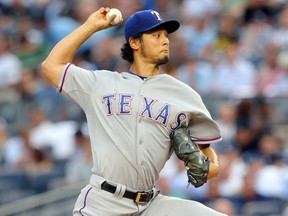 Texas Rangers starting pitcher Yu Darvish (11) pitches against the New York Yankees during the first inning of a game at Yankee Stadium. (Brad Penner-USA TODAY Sports)
