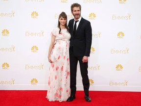 Amanda Peet from the HBO series "Togetherness" and David Benioff arrive at the 66th Primetime Emmy Awards in Los Angeles, California August 25, 2014. (REUTERS/Lucy Nicholson)