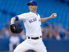Toronto Blue Jays starter J. A. Happ delivers a pitch against the Boston Red Sox in an American League regular season baseball game in Toronto, Ont. on Aug. 25, 2014. Happ is one of many players who has been placed on revocable waivers. (MICHAEL PEAKE/Toronto Sun)