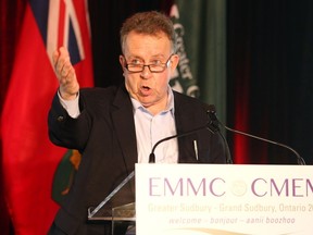 Gino Donato/The Sudbury Star   
Northern Development and Mines Minister Michael Gravelle delivers the keynote address at a mines conference at College Boreal on Monday.