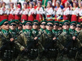 Border guards march during Ukraine's Independence Day military parade, in the centre of Kiev August 24, 2014. Armored vehicles and soldiers, some of them hardened in battle, paraded on Kiev's main square on Sunday to mark Independence Day in a defiant show of the military force Ukraine's government hopes will defeat pro-Russian separatists in the east.  REUTERS/Gleb Garanich