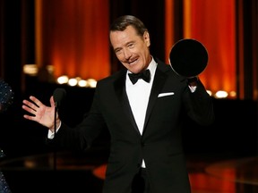 Bryan Cranston accepts the award for Outstanding Lead Actor In A Drama Series for his role in "Breaking Bad" during the 66th Primetime Emmy Awards in Los Angeles, California August 25, 2014.    REUTERS/Mario Anzuoni