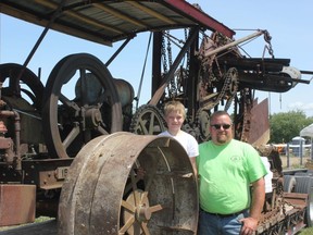 Keith Jaques and his 8-year-old son, Tyler, with their 1915 Buckeye Traction Digger.