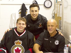 Defenceman Sam McCormack, left, has been named captain of the Sarnia Legionnaires for this upcoming season. Here is pictured in 2014 when he was first signed, along with forward Tyler Longo, to the Legionnaires. Pictured with the players is head coach Dan Rose. FILE PHOTO